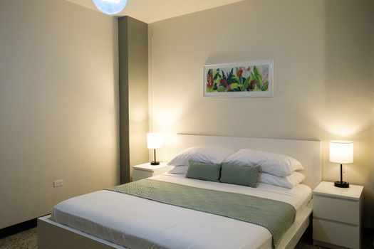 This well-appointed space combines comfort with convenience, offering a cozy bed, a small table for your essentials, and ample storage for your belongings.