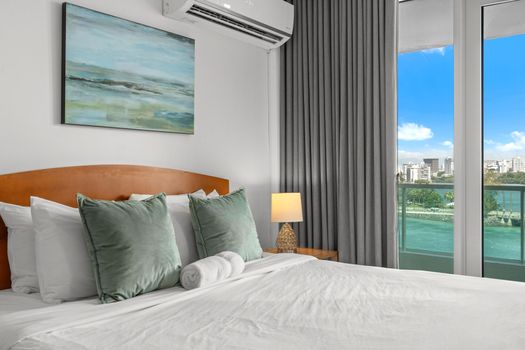 Enjoy resort-style living with a spacious bedroom area and private balcony overlooking the beautiful lagoon.