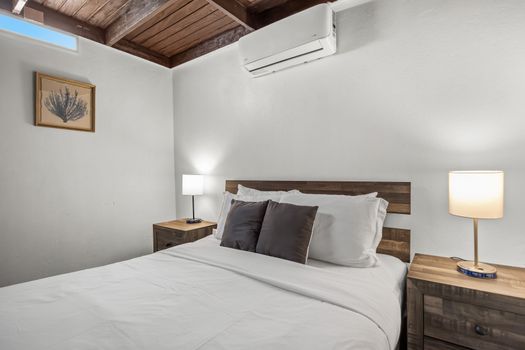 Relaxing bedroom with entertainment ready.