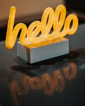 The 'hello' sign envelops you in a sense of warmth and care.