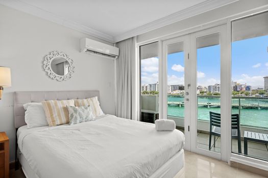 magine opening your eyes to the stunning turquoise waters just beyond your private balcony. This cozy bedroom features a comfortable queen bed and direct access to mesmerizing views, ensuring a truly unforgettable start to your day