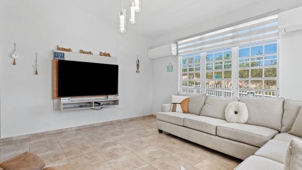 Relax in comfort! Spacious living room ideal for unwinding.