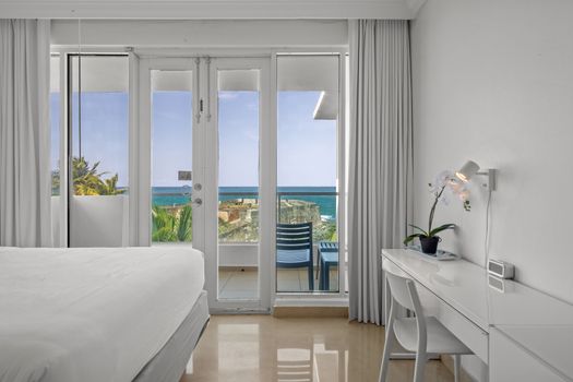 Rest in comfort and style in this beautifully appointed bedroom area. Two plush beds and elegant art ensure a peaceful night's sleep.