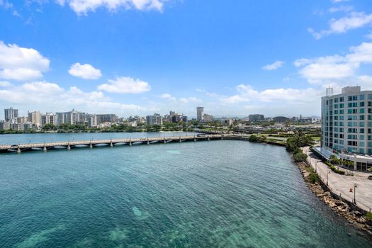 Expansive panoramic views of the glistening Condado Lagoon and city skyline.