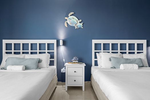 Drift off to sleep in pure comfort with crisp, white linens and plush bedding on both beds, ensuring a restful night after your San Juan adventures.