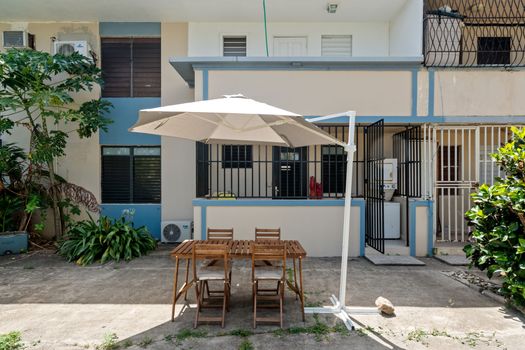 Al Fresco Dining Dreams: Enjoy delightful meals under the sun or stars on our charming outdoor patio, complete with comfortable seating and a large umbrella for shade.