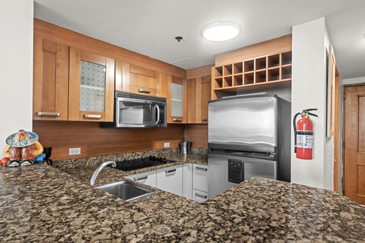 Prepare delicious meals in this sleek kitchen, featuring ample storage and modern appliances.