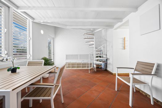 Bright and spacious dining room. This inviting dining area offers ample natural light and a comfortable setting for enjoying meals.