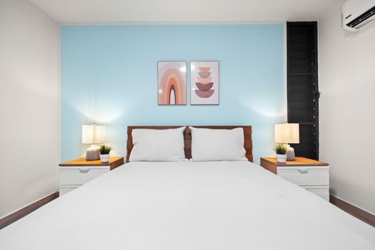Restful retreat with stylish furnishings and ample light.