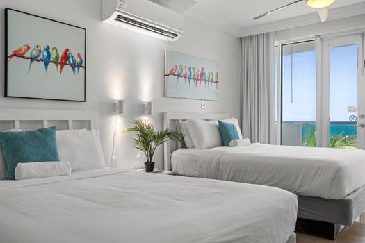 Enjoy the best of indoor comfort and outdoor beauty in this elegant studio. Large windows and a balcony offer unobstructed ocean vistas.