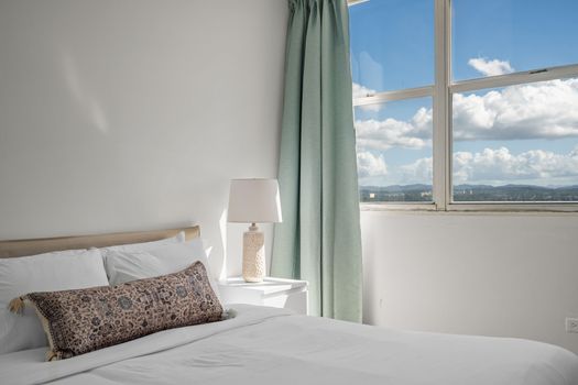 Unwind in style! This cozy bedroom provides a comfortable haven after a day of exploring, with picturesque views and a tranquil ambiance to ensure a restful night's sleep
