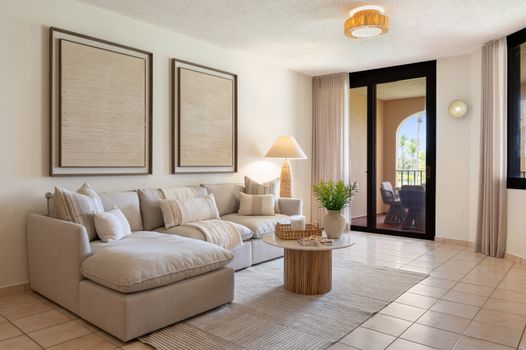 Relax in style! Our spacious living area with plush sectional sofa offers comfort and connection to the dining space.
