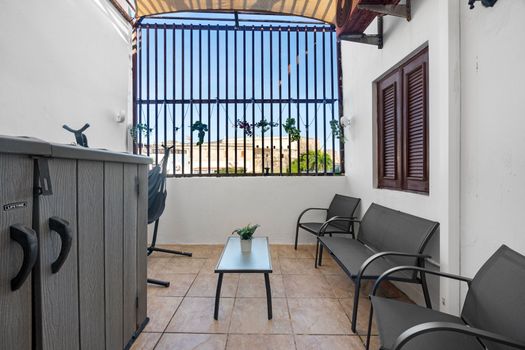 Nestled in a serene corner, this modern patio offers the perfect blend of comfort and style for your relaxation.