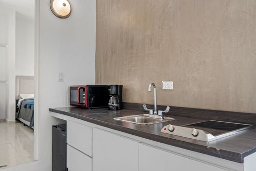 Start your day right! Our convenient kitchenette is equipped with essentials like a coffee maker, perfect for brewing your morning cup before heading out to explore or simply relaxing in.