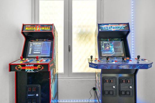 Step into a world of nostalgia with this vibrant game room, featuring classic arcade games and modern aesthetics for an unforgettable stay.