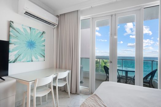 Coffee with a view! This balcony offers the perfect setting to start or end your day overlooking the ocean.