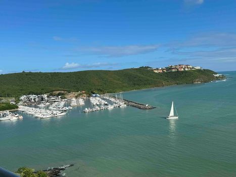 Peaceful Panoramas: Relax and take in the calming sight of the sea and the graceful movement of boats from afar.