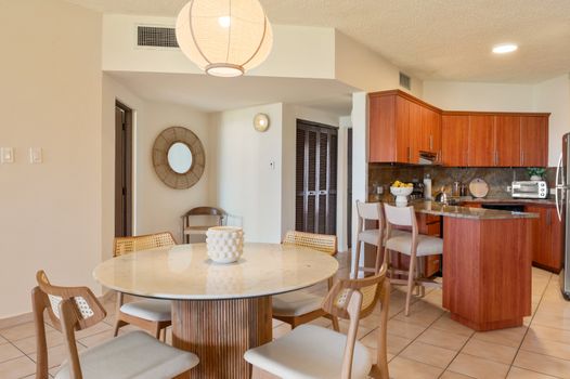 A harmonious blend of form and function, this area is ideal for sharing meals and making lasting memories.