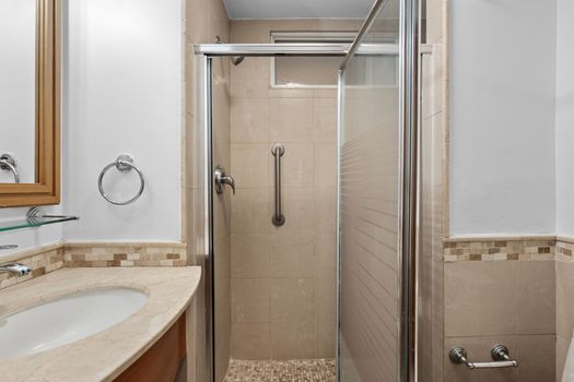 Clean and modern bathroom with a spacious walk-in shower for a refreshing start to your day.
