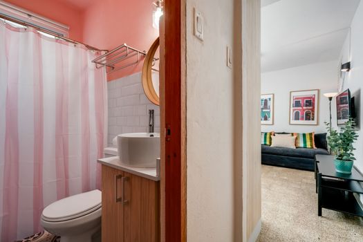 Thoughtfully Designed: From the elegant vanity to the modern fixtures, every element in this bathroom has been chosen to provide a comfortable and sophisticated experience during your stay.
