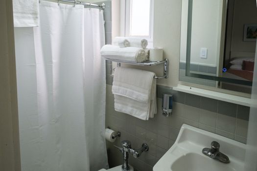 Our immaculate bathroom is always stocked with fresh, fluffy towels and essential amenities, ensuring a clean and comfortable experience for all our guests.