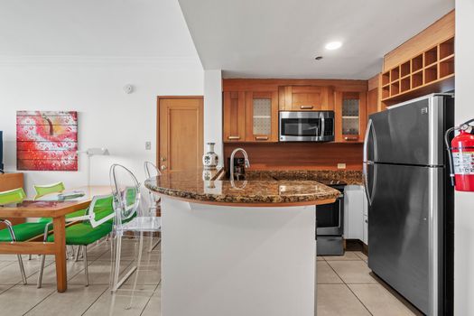 Spacious, fully equipped kitchen with ample counter space, perfect for preparing delicious meals during your stay.
