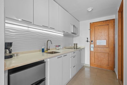 Whip up delicious meals in your fully equipped modern kitchenette, complete with a microwave, refrigerator, and stovetop