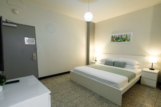 Step into your tranquil sanctuary. This clean and comfortable bedroom provides the perfect space to unwind and recharge after a day of adventures.