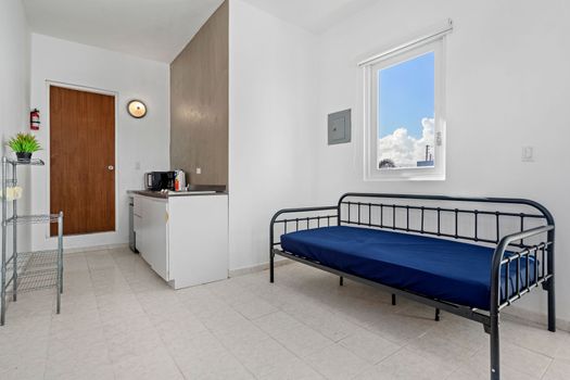 Your complete cozy retreat! This studio offers everything you need for a comfortable stay, featuring a well-appointed kitchenette and a comfortable sleeping area, all in a smartly designed space.