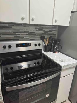 Sleek and Functional: This contemporary kitchen offers everything you need for comfortable and efficient meal preparation.
