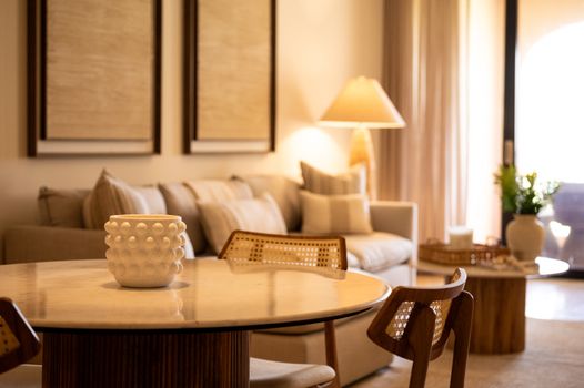 Experience modern coastal charm! Our living and dining area blends comfort with elegant, inviting decor.