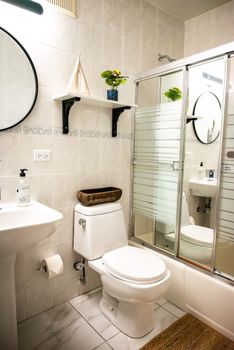 A bright and functional vanity space awaits, offering clear reflections and easy access to essentials. This thoughtful setup ensures a comfortable and hassle-free preparation for your day.