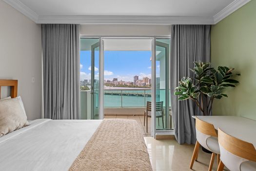 Wake up to stunning lagoon views from your comfortable bedroom, featuring two plush beds for a restful night's sleep