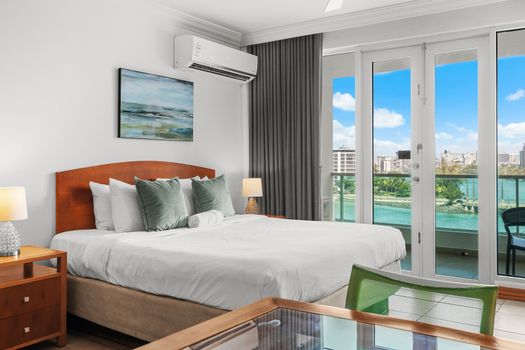 Experience pure comfort on this generously sized bed, adorned with soft pillows and a calming ambiance.