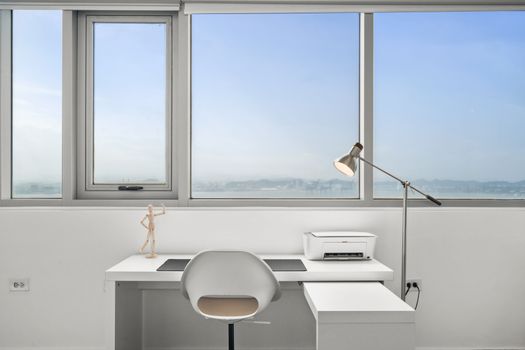 Bask in the natural light as you tackle the day's tasks in this sleek, minimalist home office.