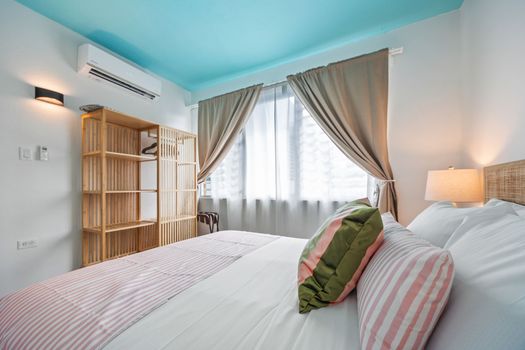 Retreat to this serene bedroom with a comfortable king-sized bed.