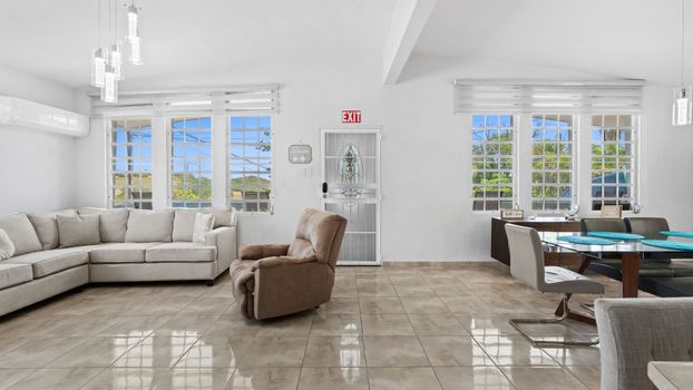 Kick back and relax: Bright living area with plenty of seating.
