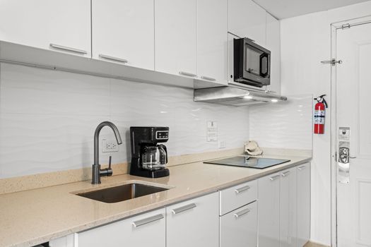 Bright and airy studio offering panoramic ocean vistas from your bed and a functional kitchenette for your convenience.