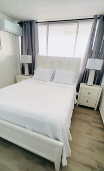 Bedroom with a View: Indulge in ultimate relaxation in this elegantly appointed bedroom, offering an unparalleled ocean backdrop.