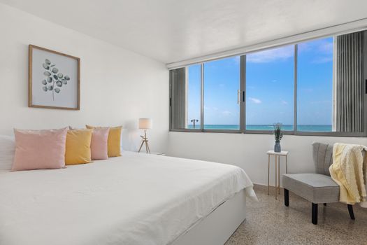 A large window allows natural light to flood the room, creating a bright and airy feel.