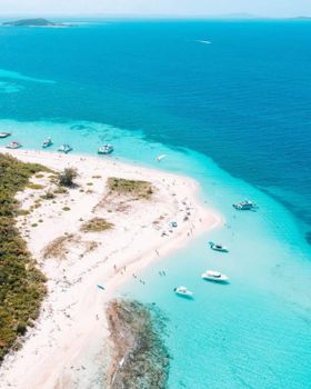 Your luxury island retreat awaits! Indulge in the serene beauty of vibrant blue waters, secluded beaches, and leisurely boat days.