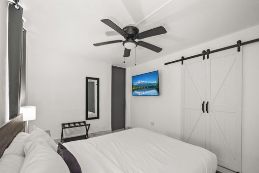 Well-appointed bedroom with bedside tables.