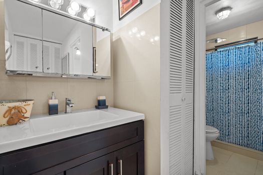 Sparkling Clean Bathroom: Refresh and rejuvenate in our pristine bathroom, featuring modern fixtures and ample space for your comfort.
