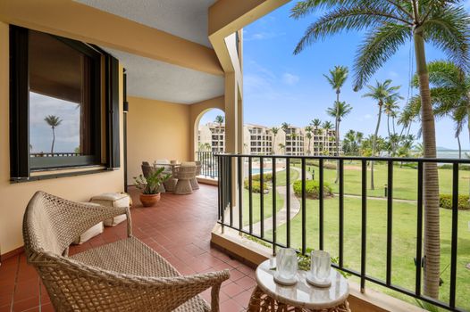 Dine al fresco with a view! Our balcony provides a charming setting with lively scenes of the swimming pool.