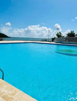 Resort-Style Living: Indulge in the luxury of a stunning swimming pool, offering the perfect escape for sunbathing and relaxation.