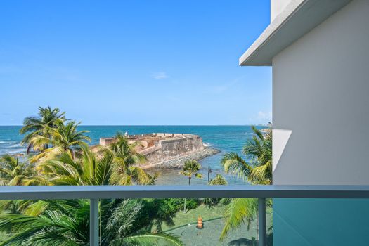 Your private balcony provides a stunning backdrop of the ocean and Condado Lagoon Villas. Perfect for enjoying your morning coffee.