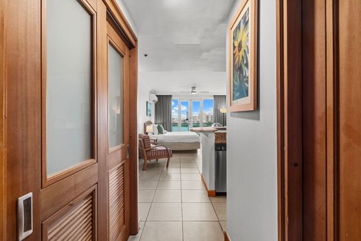 Welcome to your stylish retreat! Enjoy seamless flow from entry to the sun-drenched living space with stunning lagoon views