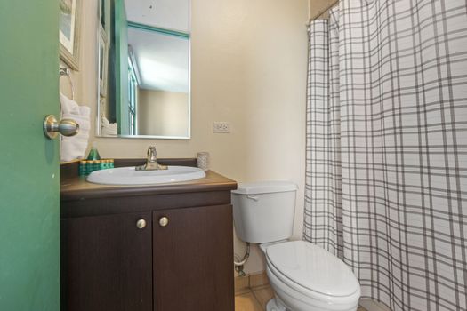 Fresh and inviting bathroom with clean towels and toiletries provided for your convenience.