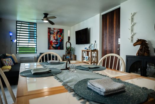 Enjoy modern living in this inviting space that combines dining and relaxation. Featuring stylish decor, a functional dining area, and a cozy lounge, it's designed for your comfort and enjoyment.