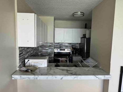 Chef's Delight Kitchen: Prepare delicious meals in this fully equipped, modern kitchen with top-of-the-line appliances.